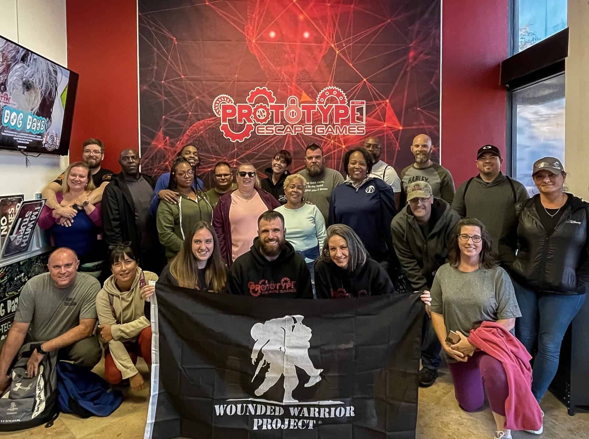 Team Building Jacksonville - Prototype Escape Games staff with Wounded Warrior Project participants at corporate team building event